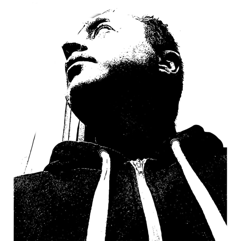 High-contrast black and white portrait of Joseph Colella, photographed from below, looking upward